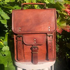 PLEASE NOTE - IM SO SORRY BUT WE CANNOT, AT PRESENT, POST TO GERMANY AS WE  DO NOT HAVE THE LICENSE FOR NON-PLASTIC PACKAGING Measurements  width  - 21cm (8.5") length - 27cm (10.5") depth  - 8cm (3") FREE UK POSTAGE We have a large range of beautiful bags large enough to carry your iPad.  This 11" goat skin leather bag has been oiled and dried in the Indian sunshine giving it a vintage look. The leather softens and the colour deepens with use.   Inside, this lined bag has 2 open pockets and a z