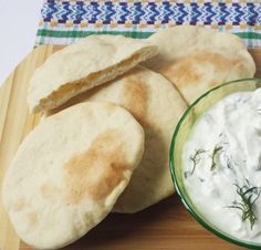 some pita bread and dip are on a plate