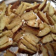 cooked potatoes in a pan with seasoning on top