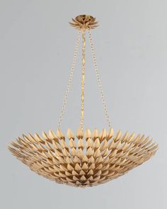 a gold chandelier hanging from a ceiling