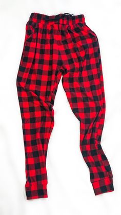 Buffalo plaid print joggers-red and black -Solid trim -Drawstring waistband -Waist pockets -Cuffed hems 92% Polyester/ 8% Spandex S/M/L/XL Measurements (Approximate) Size Waist Hips Inseam Small 26" 38" 28" Medium 28" 40" 28" Large 30" 42" 28" X Large 32" 44" 28" td {border: 1px solid #ccc;}br {mso-data-placement:same-cell;} Black Pajama Pants, Cozy Clothes, Matching Pjs, Printed Joggers, Red Tartan, Cozy Outfit, Plaid Pants, Plaid Print, Black Solid