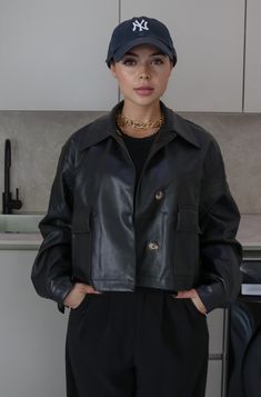 Collared Faux Leather Jacket | Color: Black | True To Size | Front Pockets and Hidden Buttons | Oversized and Relaxed Fit | Single Breasted | Cuffed and Buttoned Wrists | Cool and Breathable | Double Lined | Self: 60% Polyester, 40% Polyurethane, Lining: 100% Polyester | Hand Wash Cold, Do Not Bleach Available in Black and Beige Black Faux Leather Outerwear With Button Closure, Trendy Faux Leather Biker Jacket For Work, Black Faux Leather Cropped Jacket For Winter, Faux Leather Biker Jacket For Work In Fall, Collared Faux Leather Outerwear For Work, Trendy Faux Leather Outerwear With Pockets, Trendy Collared Faux Leather Outerwear, Winter Workwear Cropped Faux Leather Jacket, Winter Workwear Faux Leather Cropped Jacket