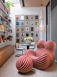 a living room filled with furniture and bookshelves