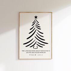 a white wall with a black and white christmas tree print on it's side