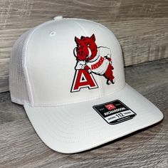 Our Pvc Patch Is A Waterproof, Rugged, And Clean Looking Design. You Can Bet That This Patch Will Look Vibrant For Years To Come. We Only Use The Highest Quality Products And Headwear. We Believe That Our Pvc Patches Beat Out Any Other Type Of Patch Offered On A Hat. Design: Arkansas Razorbacks- Leaning A Hat: Richardson 112 Color: White Structured, Six-Panel, Mid-Profile 60/40 Cotton/Polyester Adjustable Plastic Snapback Pre-Curved Contrast Stitched Visor Hat Size: 7 - 7 3/4 White Snapback Hat For Game Day, White Curved Bill Trucker Hat For Game Day, White Curved Bill Baseball Cap For Game Day, White Flat Brim Trucker Hat For Game Day, Collegiate White Snapback Trucker Hat, White Collegiate Snapback Trucker Hat, Casual White Baseball Cap For Game Day, Collegiate White Trucker Hat With Flat Bill, White Baseball Cap With Curved Brim For Game Day