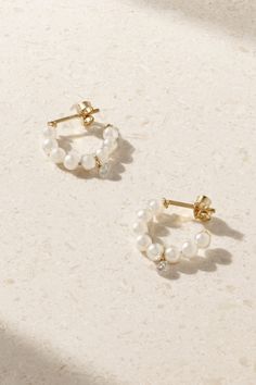 Mizuki never runs out of fresh, new ways to incorporate pearls into its pieces. These hoop earrings are cast from 14-karat gold and strung with lustrous Akoya ones and a single diamond, giving them the perfect amount of sparkle. Small Hoop Pearl Earrings In Yellow Gold, Yellow Gold Pearl Small Hoop Earrings, Small Hoop Yellow Gold Pearl Earrings, 14k Gold Hoop Pearl Drop Earrings, Yellow Gold Pearl Huggie Earrings, Gold Diamond Hoop Earrings, Pearl And Diamond Earrings, Gold Pearl Earrings, Akoya Pearls