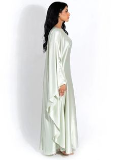 Embrace elegance in our new satin cloak, featuring long sleeves and a loose fit for comfort and style. With an O-neck design, this long dress exudes sophistication, perfect for ladies who seek a fashionable yet relaxed ensemble for any occasion. Details: Fit Type: Slim Neckline: O-Neck Material: Silk Material: SPANDEX Closure Type: Pullover Waistline: Natural Elegant Cape-style Evening Abaya, Elegant Cape Abaya For Evening, Elegant Cape Style Evening Abaya, Elegant Evening Abaya With Cape, Elegant Flowy Spring Abaya, Elegant Abaya With Cape Sleeves, Elegant Satin Maxi Abaya, Elegant Long Sleeve Solid Color Kaftan, Evening Long Sleeve Satin Maxi Dress