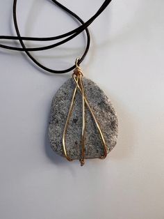 Beautiful, shiny stone found off Lake Michigan wrapped in gold wire On an adjustable necklace Handmade! Adjustable Gold Jewelry With Raw Stone, Hand Wrapped Gold Necklace With Copper Wire, Gold Necklace With Copper Wire As Gift, Gold Wire Necklaces As A Gift, Adjustable Gold Hand-wrapped Necklace, Adjustable Hand Wrapped Gold Necklace, Lake Michigan Stones, Round Lake, Wire Wrapping Stones