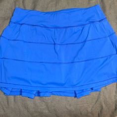 Feels And Looks The Same As Lululemon. Worn Once. Size Small. Great Condition Casual Blue Tennis Skirt For Sports, Blue Stretch Tennis Skirt With Pockets, Stretch Blue Tennis Skirt With Pockets, Blue Sporty Tennis Skirt With Lining, Blue Skirt With Built-in Shorts, Blue Sports Skort With Pockets, Sporty Blue Lined Tennis Skirt, Blue Casual Sports Skirt, Casual Blue Sports Skirt