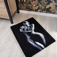 a bathroom rug with an artistic design on it