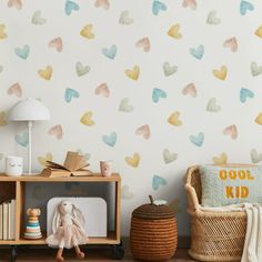 a child's room with hearts painted on the wall and toys next to it