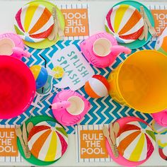 an overhead view of colorful plates, cups and napkins on a table with words that read rules the pool