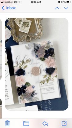 the wedding stationery is laid out on top of each other, including an envelope