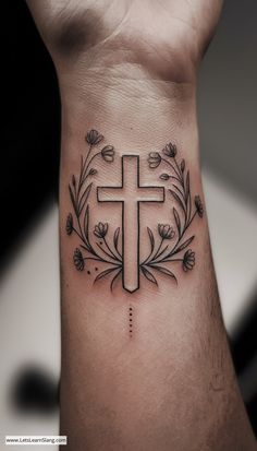 a cross on the wrist with flowers around it