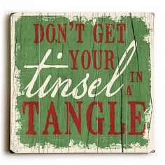 a wooden sign that says don't get your tinsel in a tangle