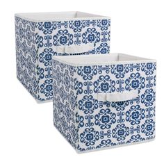 two blue and white storage bins with handles on each side, one has a flower pattern