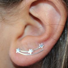 Climbing Earrings or Ear Climbers in 925 Sterling Silver decorated with Stars simulating a shooting star in the sky. These earrings are original and different, they are called climbers or climbers because of their shape that seems to go up from the earlobe through the cartilage. They are made entirely of silver and measure 23 mm long. They are very subtle and elegant and surely combine great with any look. The indicated price is for the PAIR of earrings (right ear and left ear) Star-shaped Ear Climbers As Gift, Star-shaped Ear Climbers For Pierced Ears, Star Shaped Ear Climbers As Gift, Silver Star-shaped Ear Cuff As Gift, Star-shaped Ear Climbers For Gift, Silver Star Shaped Ear Cuff As Gift, Silver Star-shaped Ear Cuff For Gift, Silver Star Shaped Ear Cuff Gift, Climbers Earrings