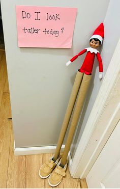 an elf with a pink sign on the door