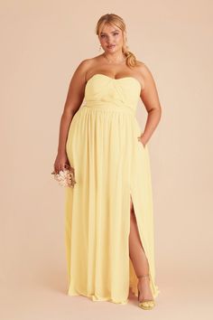 a woman in a long yellow dress