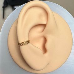 a close up of a cake with a ring on it's top and the inside of its ear