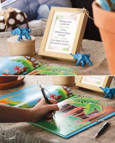 there is a child's hand writing on a book with an elephant figurine next to it