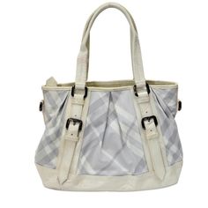 This Victoria Tote Bag Sports The Iconic Burburry Nova Check Pattern On Its Exterior. It Features Glossy White Patent Leather Trim And Flat Handles That Sit Easy On The Arm Or Shoulder. The Centre Zipper Closure Opens To A Spacious, Fine Textile-Lined Interior With One Zip Pocket And Two Flat Pockets For Convenience. It Is Finished With Durable Gunmetal Hardware. Shoulder Strap Drop 8" Inches Adjustable Made In Italy Please Note That Most Items That We Carry Have Been Previously Owned. Unless Ot White Shoulder Bag With Silver-tone Hardware And Double Handle, White Shoulder Bag With Silver-tone Hardware For Daily Use, White Satchel With Silver-tone Hardware For Office, White Shoulder Bag With Silver-tone Hardware For Travel, White Tote Shoulder Bag With Silver-tone Hardware, White Office Satchel With Silver-tone Hardware, White Crossbody Satchel With Silver-tone Hardware, White Bags With Silver-tone Hardware And Double Handle, White Bags With Silver-tone Hardware For Errands