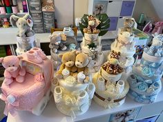 several different types of baby items on display in a store or nursery room with stuffed animals and diapers