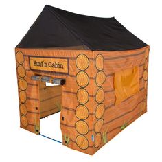 a tent that is made to look like it has been painted orange and black with the words hunt'n cabin on it