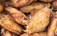 closeup of chicken wings with seasoning on them