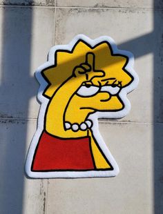 the simpsons sticker is on the side of a building