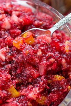 cranberry sauce in a glass bowl with a spoon