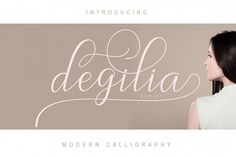 a woman with long black hair wearing a white dress and the words degitia script