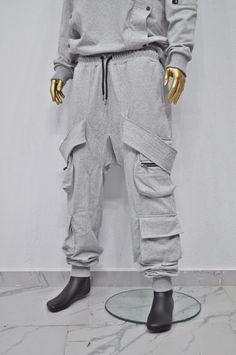 Winter Gray Cargo Pants With Side Pockets, Fitted Hip Hop Cargo Pants With Pockets, Gray Cotton Winter Cargo Pants, Fitted Winter Cargo Pants With Side Pockets, Winter Combat Style Baggy Cargo Pants, Baggy Combat Cargo Pants For Winter, Winter Combat Baggy Cargo Pants, Fitted Gray Cargo Pants With Cargo Pockets, Fitted Gray Cargo Pants With Pockets