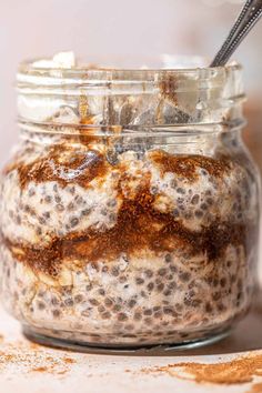 a jar filled with oatmeal sitting on top of a table