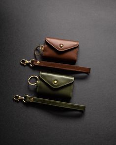 Made of our premium full-grain leather, this wallet is ideal for the on-the-go, multitasking minimalist. Featuring brass hardware and expanding sides, conveniently carry up to 10 cards and cash with added flair. Go hands free with the wrist lanyard, while the magnetic snap button allows for quick access to your cards. Leather Lanyard Wallet, Luxury Leather Wallet On Chain With Adjustable Strap, Leather Wallet On Chain With Adjustable Strap, Leather Wallet With Detachable Strap, Leather Wallets With Key Leash For Daily Use, Leather Wallet With Key Leash For Daily Use, Leather Wallet With Detachable Strap For On-the-go, Womens Wallet, Wrist Lanyard