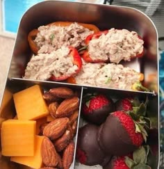 four different types of food in a metal container