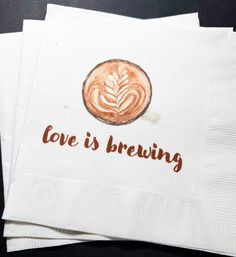 three napkins with the words love is brewing printed on them