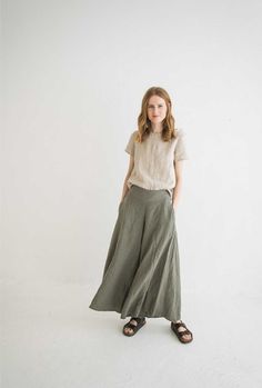 "DETAILS * Long wide leg linen pants * Summer linen cullotes * With two side pockets and side zipper * Femine look for your linen outfit * Made from soft wash medium weight (185 gsm) 100 % European linen fabric * Height of the model is 177 cm (5' 8\") and she is wearing pants in size XS/S, sage green color * Please choose another color and size on the right * Product number: P10 CARE LABEL * machine wash gentle (40 C/104 F) * dry gentle on low heat * wrinkles give the character so there is no ne Khaki Wide Leg Cargo Pants, Midsize Linen Pants Outfit, Khaki Linen Bottoms With Pockets, Wide Leg Linen Pants With Side Pockets, Khaki Linen Pants With Side Pockets, Wide Leg Flax Bottoms With Pockets, Khaki Linen Ankle-length Pants, Khaki Wide-leg Linen Pants, Linen Wide Leg Pants With Side Pockets