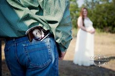 a man and woman standing next to each other with their hands in the back pocket