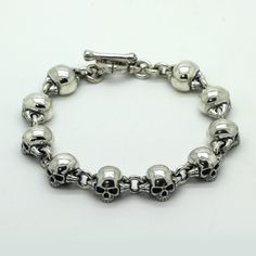 SKU: i3698 Beautiful bracellet with skull and bones parts. Features: Brand new sterling pendant silver 925. Not plated, 100% solid silver metal! The average weight of the product - 57.0 g. (22.5cm Lenght); Processing - Blacked oxidation; Availability of proprietary tag manufacturer - Yes; Country of origin - Ukraine; FAQs about Bracelet Fit - https://www.overstock.com/guides/faqs-about-bracelet-fit More products on www.indigo.jewelry Online Cataloque www.indigo.shop Sterling Silver Skull Jewelry Hallmarked, Sterling Silver Skull Jewelry With Polished Finish, Silver Skull Stainless Steel Jewelry, Silver Stainless Steel Skull Jewelry, Classic Sterling Silver Skull Jewelry, Nickel-free Symbolic Sterling Silver Bracelet, Classic Engraved Skull Jewelry, Indigo Jewelry, Average Weight