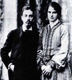 an old black and white photo of two people