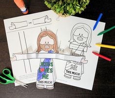 two coloring pages with jesus loves me and this much on them next to some crayons