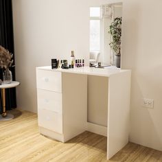 a white desk with some bottles on top of it and a mirror in the corner