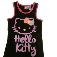 This Hello Kitty Tank Top Is A Must-Have For Any Fan Of The Adorable Feline. The Black Racerback Design Is Perfect For Everyday Wear, And The Glitter Accents Add A Touch Of Sparkle To Any Outfit. Available In Multiple Sizes, Including Xs And L, This Top Is Ideal For Women Of All Sizes. The Brand Is Well-Known For Its Quality Products, And This Tank Top Is No Exception. Whether You're Lounging At Home Or Out Running Errands, This Top Is Sure To Keep You Comfortable And Stylish. Cute Black Cotton Tank Top, Fitted Black Hello Kitty Top, Fitted Black Hello Kitty Print Top, Fitted Black Top With Hello Kitty Print, Black Sleeveless School Top, Y2k Black Hello Kitty Print Top, Cute Black Tops For School, Playful Black Tops For School, Hello Kitty Tank Top