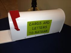 a white mailbox with a red arrow on it that says cards and letters to nathan