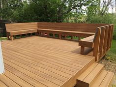 a large wooden deck with benches on it