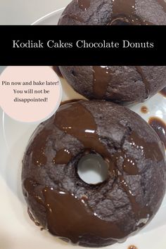 two chocolate donuts on a plate with the words kodak cakes chocolate donuts