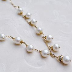 This romantic white pearl necklace is handmade with perfectly polished natural freshwater pearls and just enough sparkly Swarovski crystal accents. Expertly hand wire wrapped with 14k gold filled wire, chain and clasp. A gorgeous statement necklace for a blushing bride on her wedding day. A thoughtful gift for a woman born in June since her birthstone is the precious pearl. Necklace Details: - Necklace Length is 18 inches (43.18 cm) plus a 1 inch extender for the perfect fit - The central pendan Victorian Bridal Necklace, Birthday Gift For Mother, Pearl Bracelet Gold, Crystal Wedding Jewelry, Bridal Party Jewelry, June Birthday, Blushing Bride, White Pearl Earring, Detailed Necklace