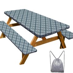 a picnic table with two benches and a drawstring bag next to it on a white background