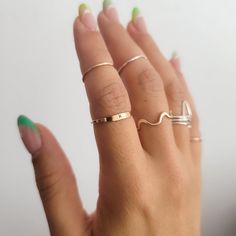 Letter Ring - Stacking Rings - Dainty Ring - Stackable Ring Bands - Amaná Penina Description These modern minimalistic stacking ring make a great set and work well as everyday jewelry. The stacking rings are just right for wearing alone, as a knuckle ring or as a set. Also available in 14k Gold-filled. Please feel free to contact us for any customization ideas and requests! About Amaná Penina Every single product we made is handmade and made to order in your size in our workshop located in San J Minimalist Adjustable Round Band Rings, Adjustable Minimalist Round Band Rings, Adjustable 14k Gold Midi Rings For Everyday, Dainty Hypoallergenic Rings For Everyday, Adjustable Stackable Midi Promise Rings, Adjustable Toe Ring For Everyday Wear, Simple Stackable Initial Ring For Everyday, Dainty Stackable Open Band Rings, Dainty Everyday Ring With Tiny Details